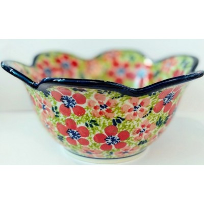 A bowl with small flowers -...